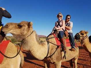 Cynthia and Dustyn Harvey enjoy a camel ride during their Mystery Break to Central Australia. Picture: Contributed