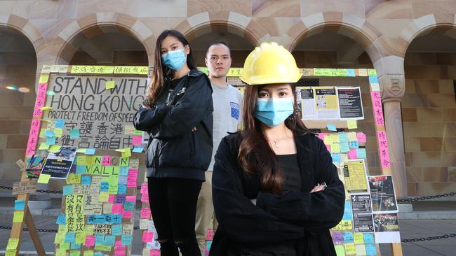 UQ students Phoebe Fann, Andrew Lee and Christy Leung, who have been involved in the Lennon's Wall protest at UQ in solidarity with their countrymen back in Hong Kong, St Lucia. Picture: Liam Kidston