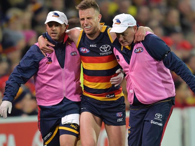 Brodie Smith of the Crows is carried off injured during the AFL qualifying final match between the Adelaide Crows and GWS Giants at the Adelaide Oval in Adelaide, on Thursday, September 7, 2017. (AAP Image/David Mariuz) NO ARCHIVING, EDITORIAL USE ONLY