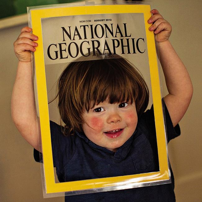 The photographer’s son, at age two, grins on a mock-up cover. Picture: @argonautphoto/National Geographic
