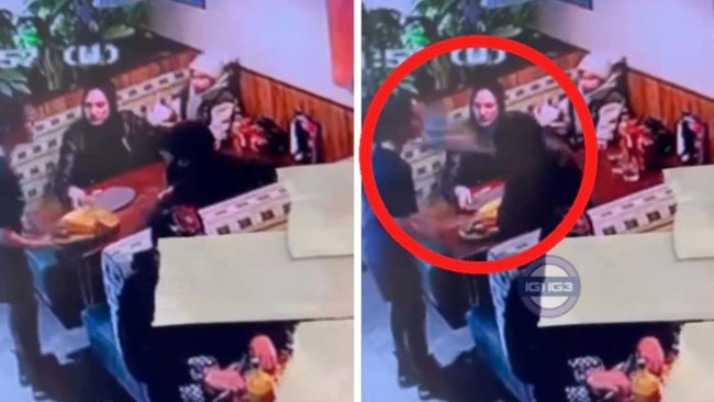 Police have arrested a man after a viral video showing a waitress being slapped with a plate.