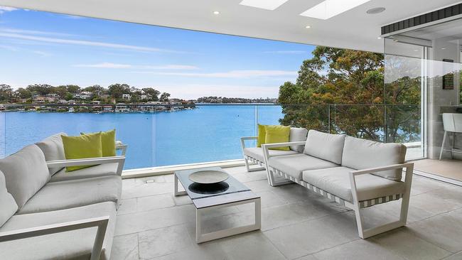 The five-bedroom, three-bathroom home sits on Oatley Bay.