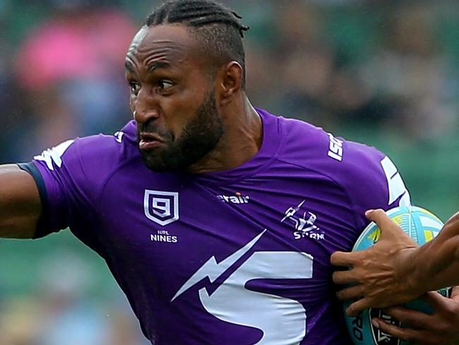 PERTH, AUSTRALIA - FEBRUARY 15: Justin Olam of the Storm fends off the brisbane tackler during the match between the Broncos and Storm from Day 2 of the 2020 NRL Nines at HBF Stadium on February 15, 2020 in Perth, Australia. (Photo by James Worsfold/Getty Images)