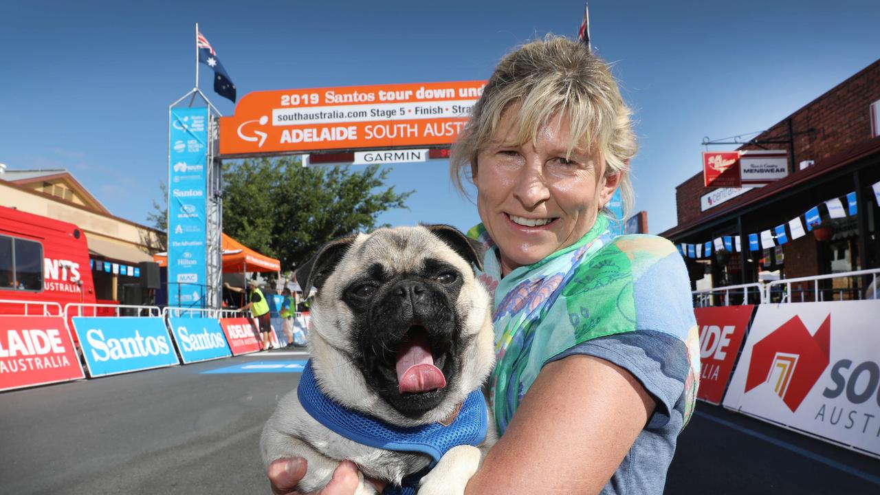 Waiting for the riders to arrive in Strathalbyn, Angela Whyte of Grange and her Pug, “Gus” (AAP Image/Dean Martin)