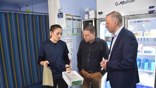 Nurse manager Jessica Craig showing Labor candidate for Flynn Matt Burnett and leader of the opposition Anthony Albanese Covid-19 vaccines