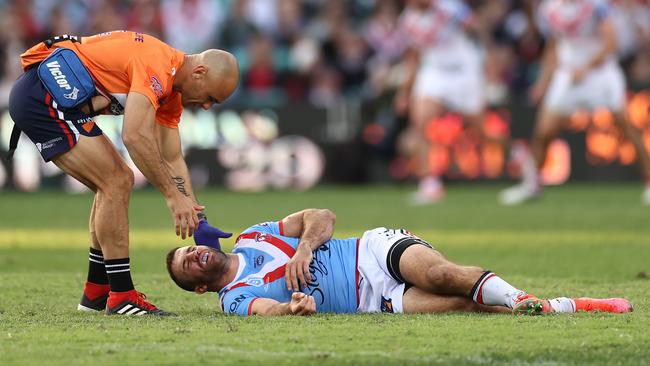 James Tedesco is attended to by a trainer after being concussed. Picture: Getty Images