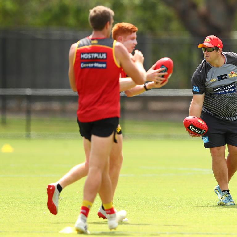 Coach Stuart Dew handballs during a Gold Coast Suns AFL media and training session at Metricon Stadium. (Photo by Chris Hyde/Getty Images)