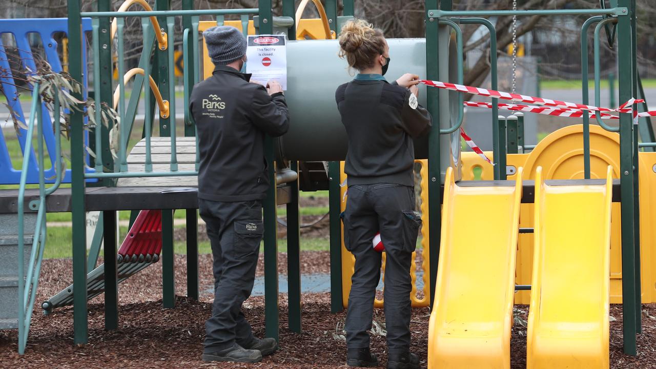 Parks staff close down a children’s park in Albert Park during a Covid-19 lockdown in Melbourne. Picture: David Crosling