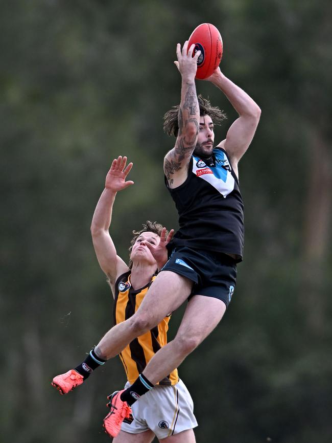 NFL: St Mary’s Jake Dambrauskas marks over Lower Plenty’s Billy Reardon. Picture: Andy Brownbill