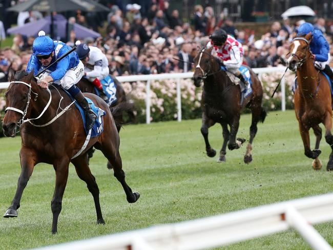 Hartnell (blue silks) is beaten up badly by Winx in Saturday’s Cox Plate. Picture: George Salpigtidis