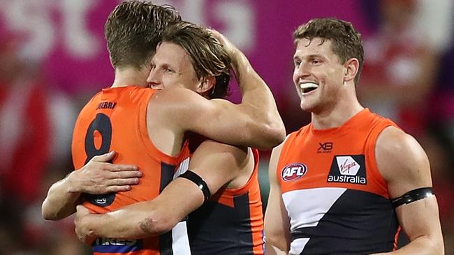 Lachie Whitfield and Callan Ward celebrate after the Giants’ win against Sydney. Picture: Getty Images