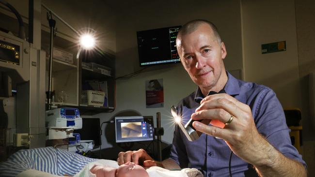 Geelong Hospital Barwon Health Dr Dave Fuller Clinical Director Women Children and Families with a prem baby mannequin holding a video laryngoscope. Picture: David Caird