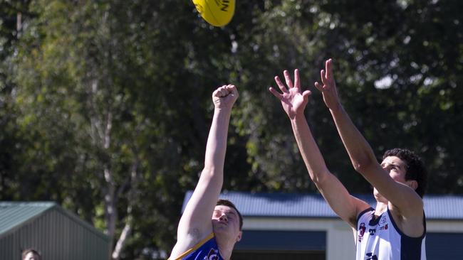 Jindalee’s Sterling Mitchell and Coorparoo’s Samuel Cosmo reach for the ball.(Image Sarah Marshall)