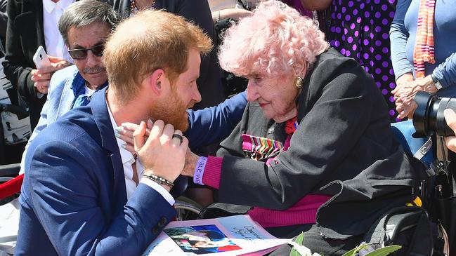 Prince Harry, Duke of Sussex, warmly embraces Daphne Dunne at the Sydney Opera House today. Picture: Samir Hussein