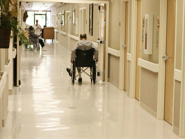 man in wheelchair in aged care nursing home Istock 000001329263large