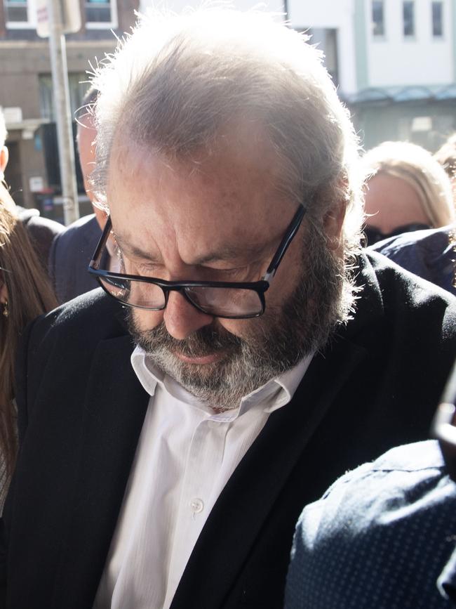 Brett Button arrives at Newcastle court surrounded with family and friends. Picture: Jeremy Piper