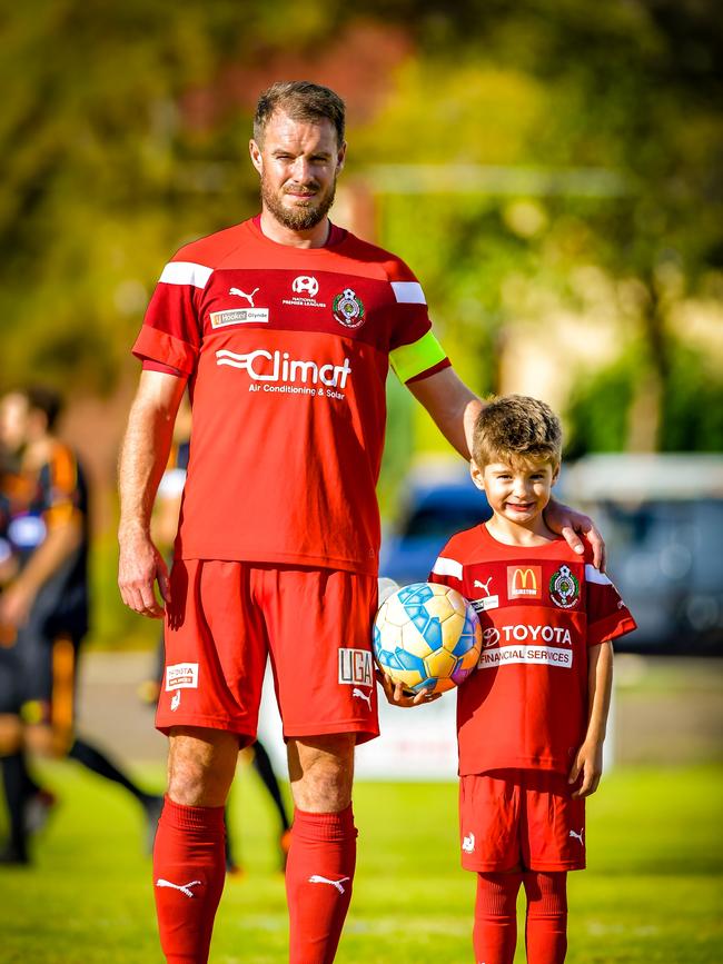 Campbelltown City captain Iain Fyfe, picture with his son, Lennon, last season. Picture: Picture: Ken Carter