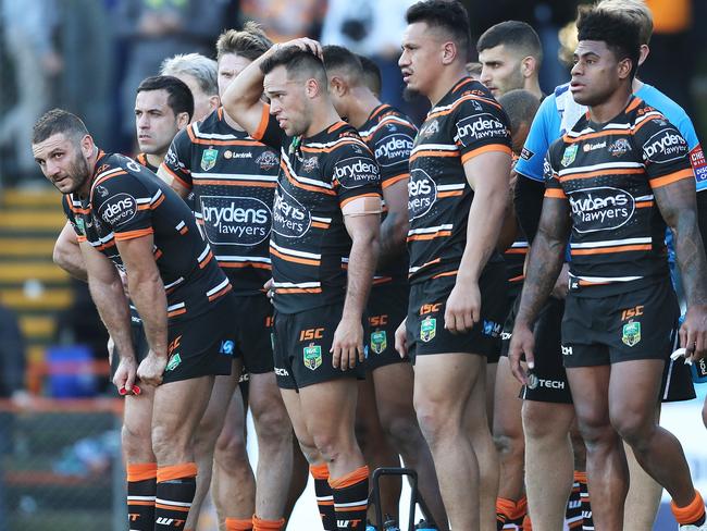 Robbie Farah (Far left) looks on with teammates during the Tigers’ disappointing loss to Gold Coast. Picture: Brett Costello