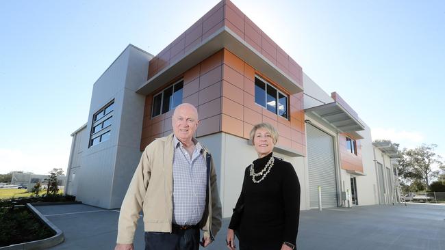 Bill Barry-Cotter and Leonie Smith in front of the virtually complete 'prestige' industrial units at Coomera. Photo by Richard Gosling