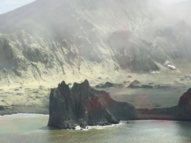 Rescuers arrive on White Island after the volcano eruption. Picture: Auckland Rescue Helicopter Trust