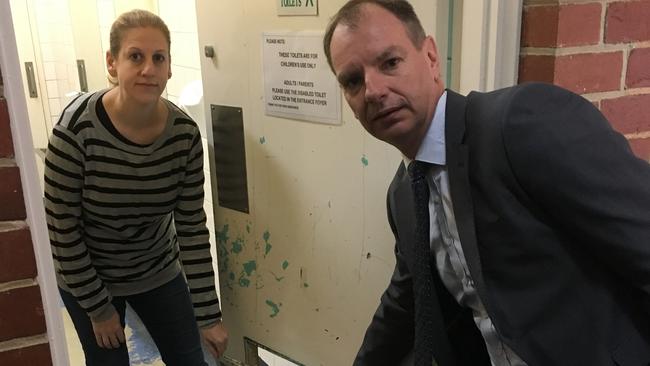 Caulfield South council president Melanie Gordon and Caulfield MP David Soutwick inspect the poor state of school facilities in 2018.