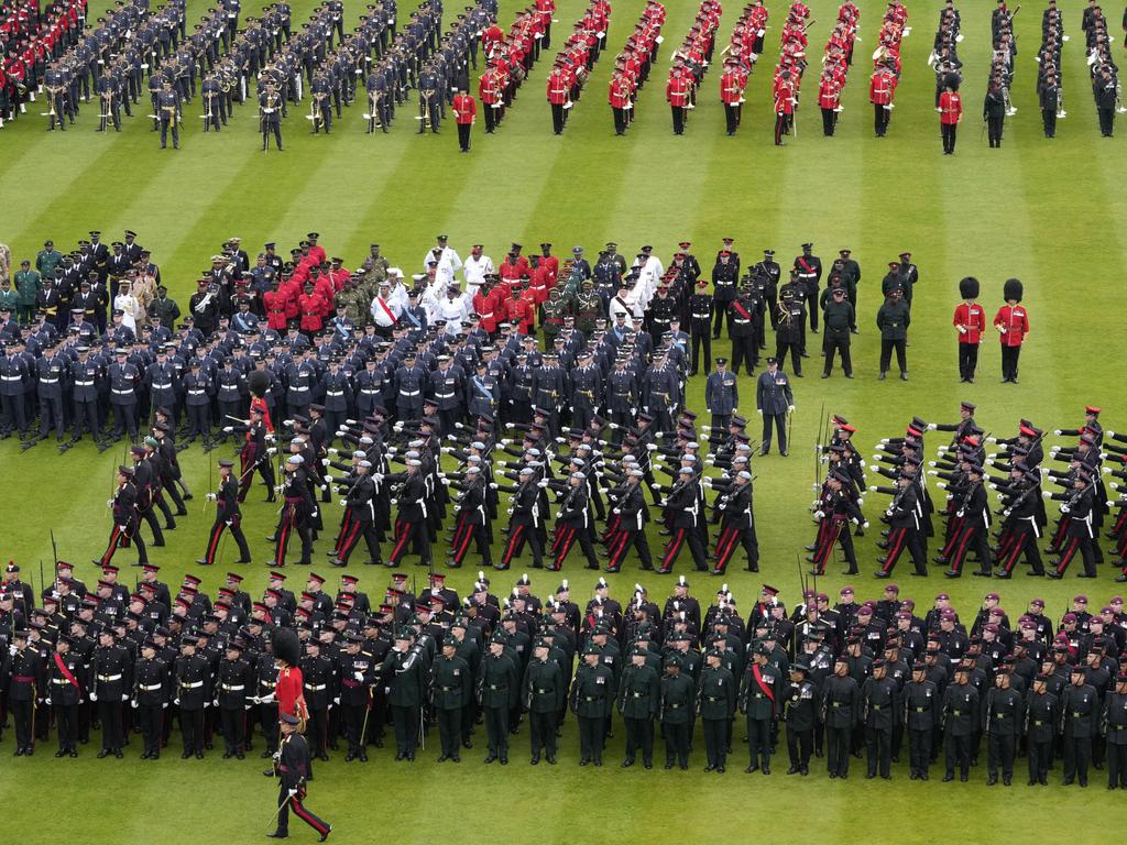 Members of the armed forces stand in formation on the lawn of Buckingham Palace. Picture: Peter Dejong – WPA Pool/Getty Images