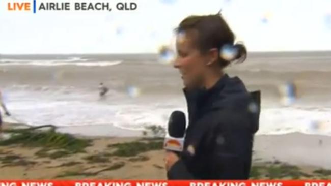 “That’s not good, that’s not smart,” says Jess Millward as the man tests the waves in the background. Picture: Channel 9