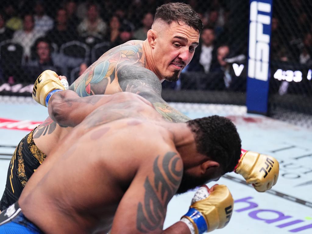 Aspinall drops Curtis Blaydes just 50 seconds into their fight. Picture: Chris Unger/Zuffa LLC via Getty Images