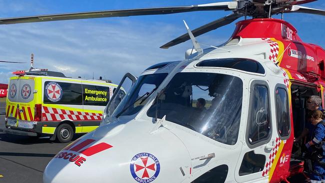 Westpac Rescue Helicopter at Coffs Harbour Airport where they met NSW Ambulance to fly a man in his 20s to the Gold Coast University Hospital on Wednesday.