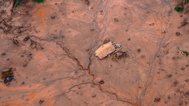 Aerial view in 2015 shows the village of Bento Rodrigues, in Mariana, submerged in mud. Picture: AFP