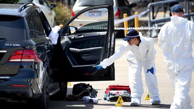 Forensic police tag the area. Picture: Toby Zerna