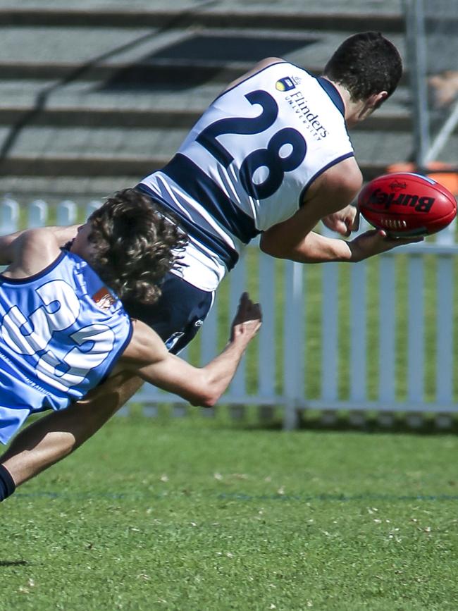 Riley Grundy makes a tackle against South Adelaide at Unley Oval. Picture: AAP/Mike Burton