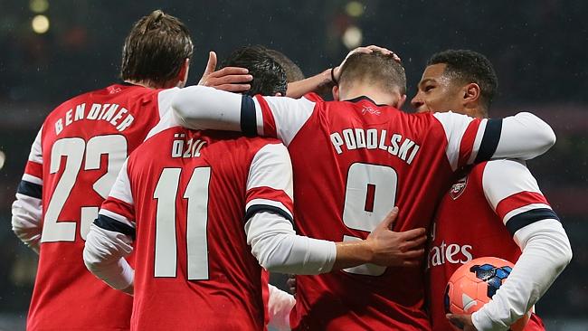 Poldoski celebrates his first goal with teammates.