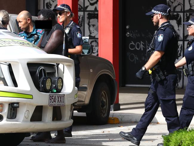 The the Queensland border reopening to the rest of Australia on Monday,  Cairns police officers will be out in force in the CBD, targeting anti-social and criminal activity. Police officers assist paramedics with a heavily intoxicated man in the Shields Street Mall. Picture: Brendan Radke