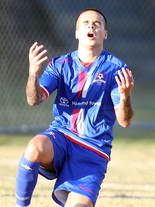 Robina (blue shirts) took on Southport in Gold Coast Premier League round 3 today. Both teams were promoted from a lower league last season and this is the first time they have clashed in the Gold Coast Premier League. Photo of Brandon Chin after nearly scoring. Photo by Richard Gosling