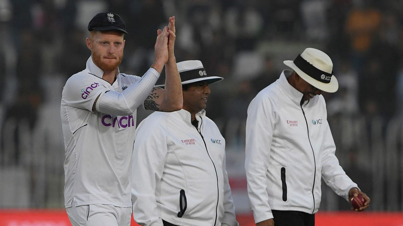 England's Ben Stokes (L) gestures after their victory at the end of the fifth and final day of the first cricket Test match between Pakistan and England at the Rawalpindi Cricket Stadium, in Rawalpindi on December 5, 2022. (Photo by Aamir QURESHI / AFP)