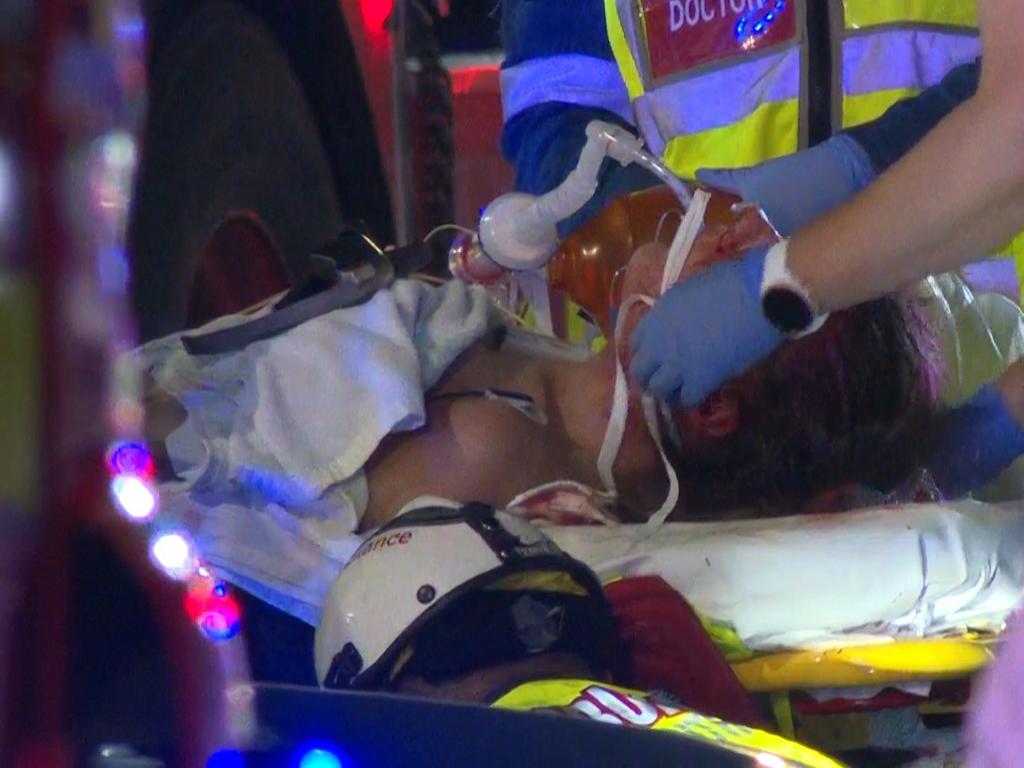 Pictured are emergency services attending a car crash after a Police pursuit on Railway Parade, Canley Vale when the vehicle being pursued lost control and hit a telegraph pole trapping two people. Picture: TNV