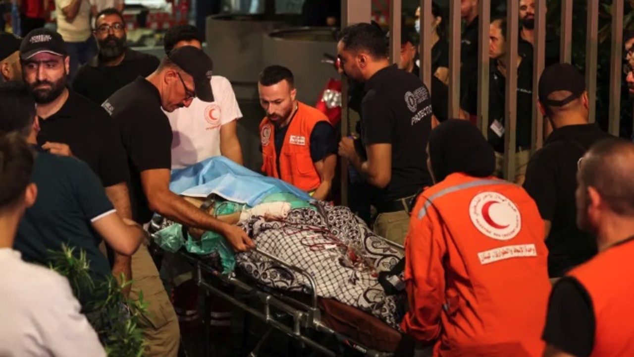 A person on a stretcher being carried into American University of Beirut Medical Center after Israel detonated thousands of pagers belonging to Hezbollah members on Sept. 18, 2024. Picture: REUTERS/Mohamed Azakir