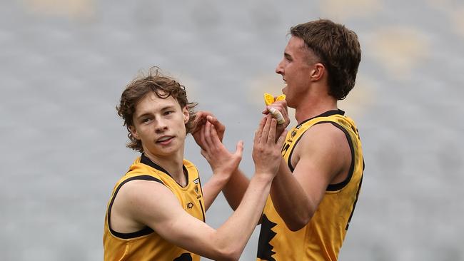 PERTH, AUSTRALIA - JUNE 23: Cody Angove and Bo Allan of Western Australia celebrate a goal during the Marsh AFL National Championships match between U18 Boys Western Australia and Victoria Metro at Optus Stadium on June 23, 2024 in Perth, Australia. (Photo by Paul Kane/AFL Photos/via Getty Images)