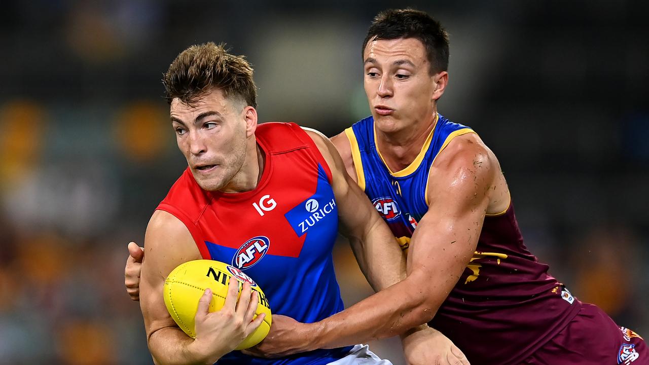 Hugh McCluggage tackles Melbourne’s Jack Viney in one of the Lions’ two wins so far this season. Picture: Albert Perez / AFL Photos via Getty Images