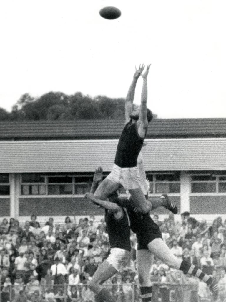 Phil Carman, 1974, taking one of his many screamers for Norwood during the 58 games he played for the club. Norwood footy fans have until the end of the month to soak up a fascinating display of historic memorabilia. Image: Norwood Football Club