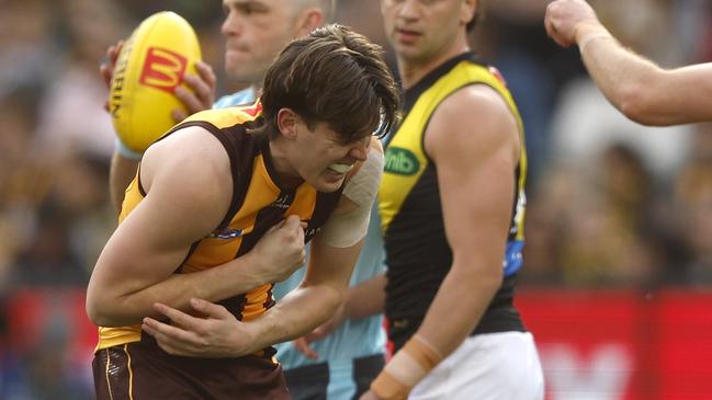 Will Day hunches over after colliding with a teammate at the MCG. Picture: Darrian Traynor/Getty Images