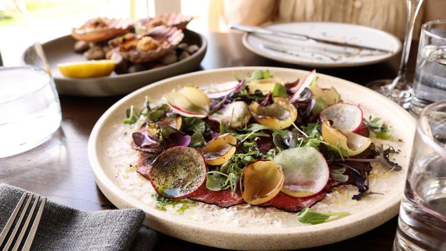 Evenfall’s carpaccio features delicate slices of eye fillet complemented with York Town greens, shaved grana padano, charred pickling onions, and dried capers. Picture: Stephanie Dalton