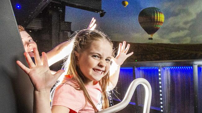 Dreamworld. Lola, 7 (front) and Hugo Lange, 9 from Brisbane on Dreamworld's new ride the Sky Voyager. Picture: NIGEL HALLETT