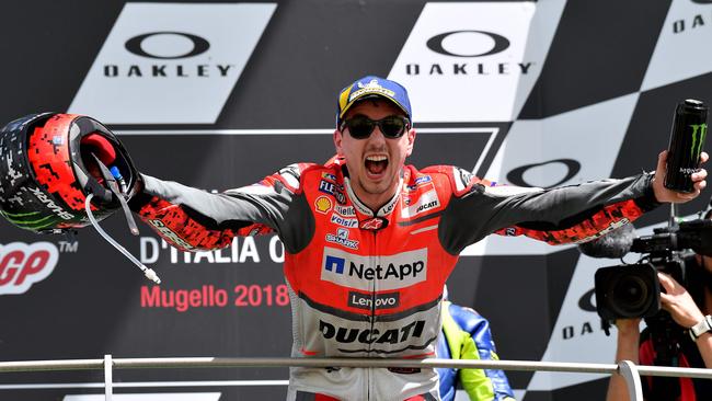 Ducati Team's Spanish rider Jorge Lorenzo celebrates on the podium after winning the Moto GP Grand Prix at the Mugello race track on June 3, 2018 / AFP PHOTO / TIZIANA FABI