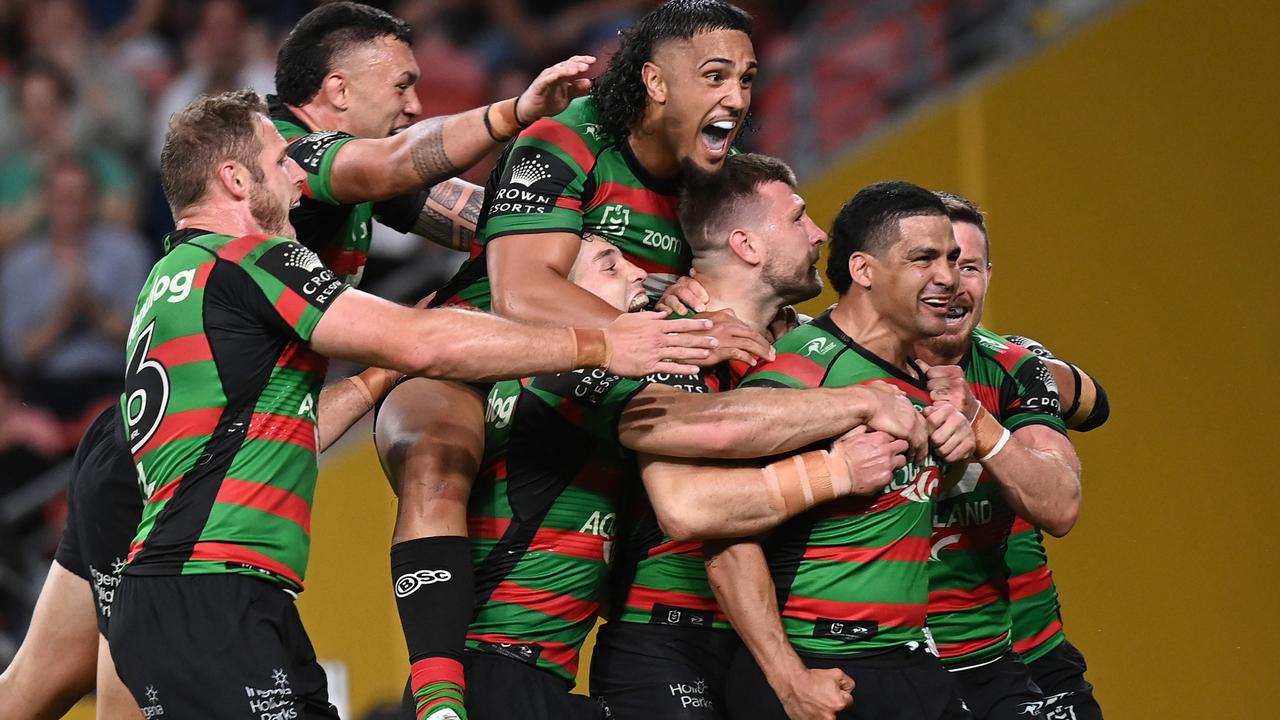 BRISBANE, AUSTRALIA - SEPTEMBER 24: Cody Walker of the Rabbitohs celebrates with team mates after scoring a try during the NRL Preliminary Final match between the South Sydney Rabbitohs and the Manly Sea Eagles at Suncorp Stadium on September 24, 2021 in Brisbane, Australia. (Photo by Bradley Kanaris/Getty Images)