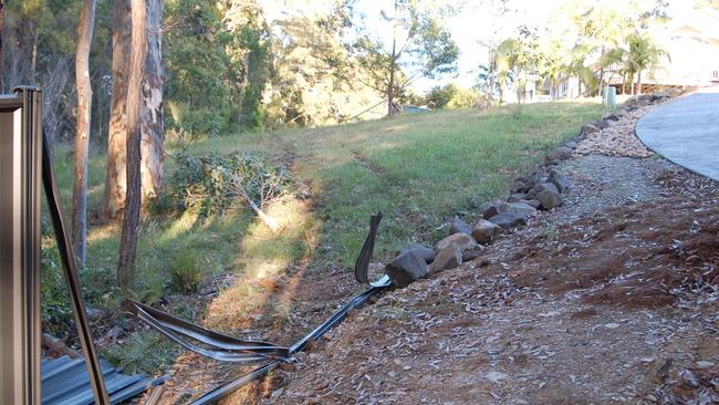 Careening though the fence, the Nissan Skyline came to a halt after colliding with an exposed beam. Picture: Supplied