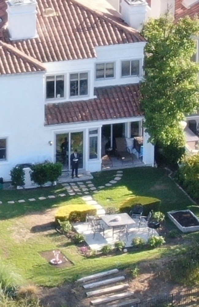 Authorities visit the house in the wake of Keough’s death. Picture: Backgrid