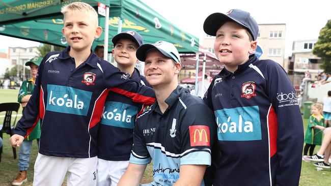 Smith with fans at Coogee Oval. (Photo by Mark Metcalfe/Getty Images)