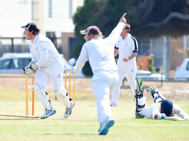 Gone: Aspendale keeper Ben Lawrence disturbs the stumps to run out Mentone opener Blake Thompson. Picture: Josie Hayden